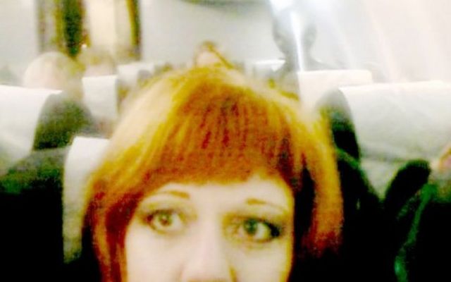 The woman took a selfie on the plane