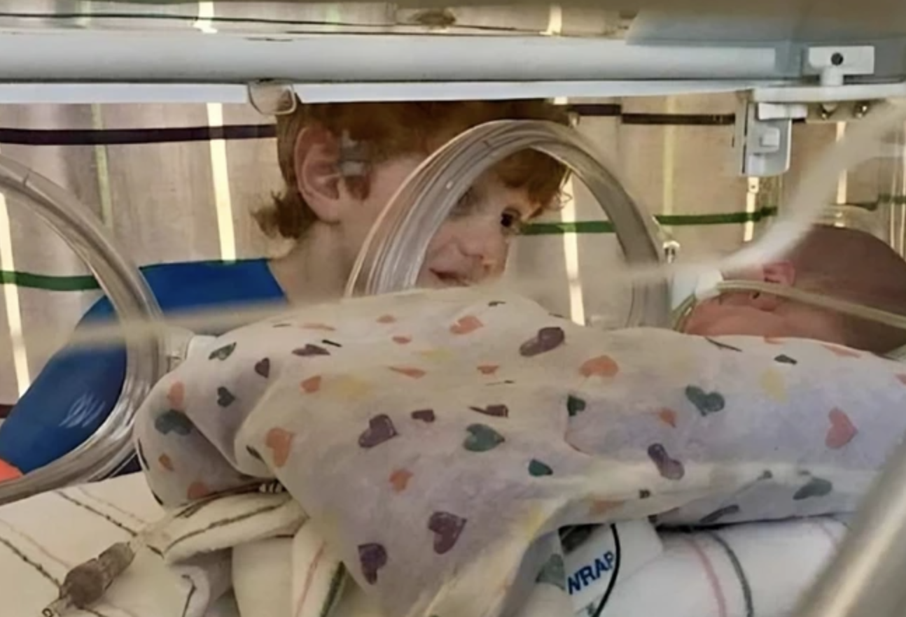 Photos of a Boy Holding His Premature Brother Go Viral as Mom Reveals the Heartwarming Story Behind the Shots