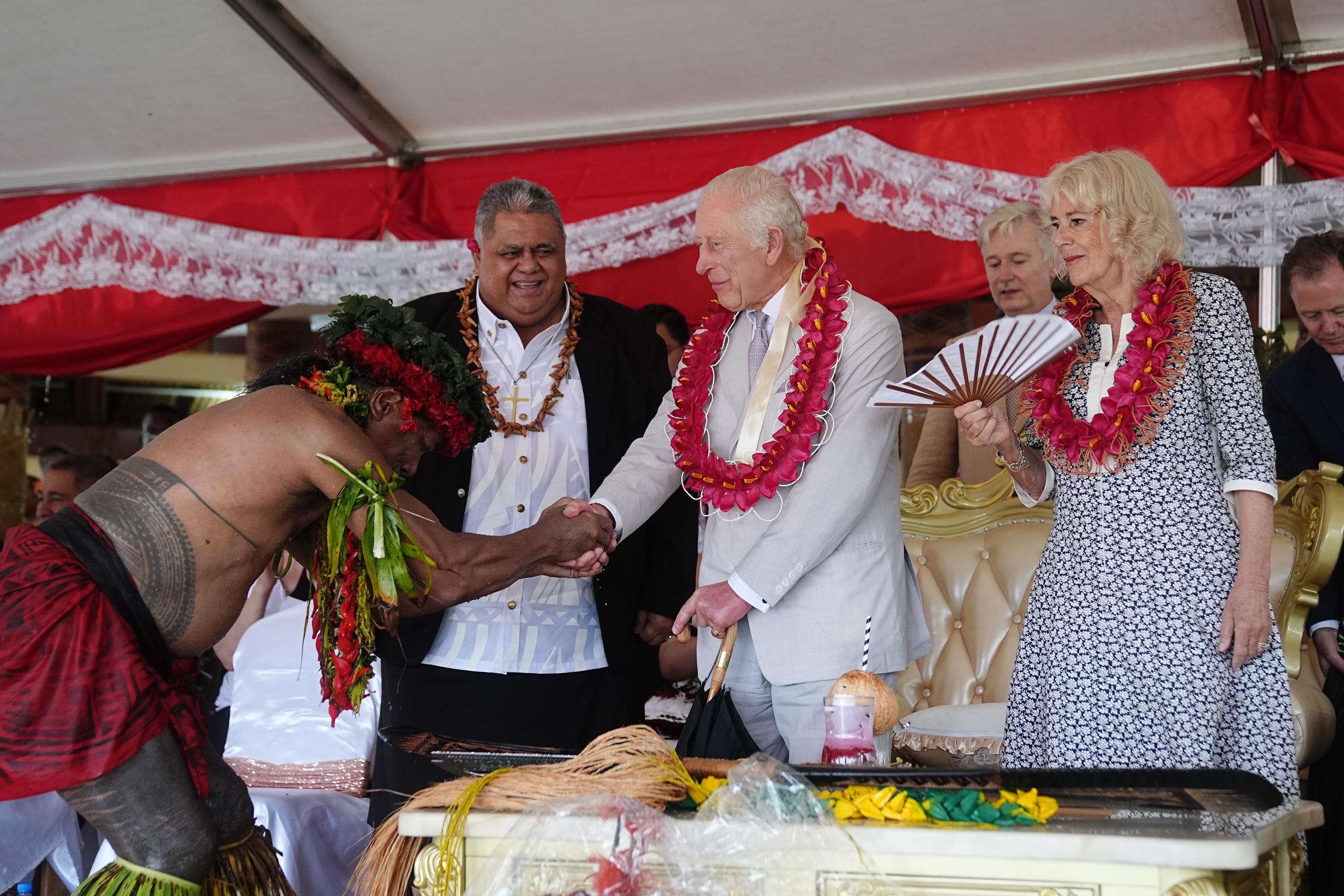 King Charles III and Queen Camilla with Samoan locals and officials. | Source: Getty Images