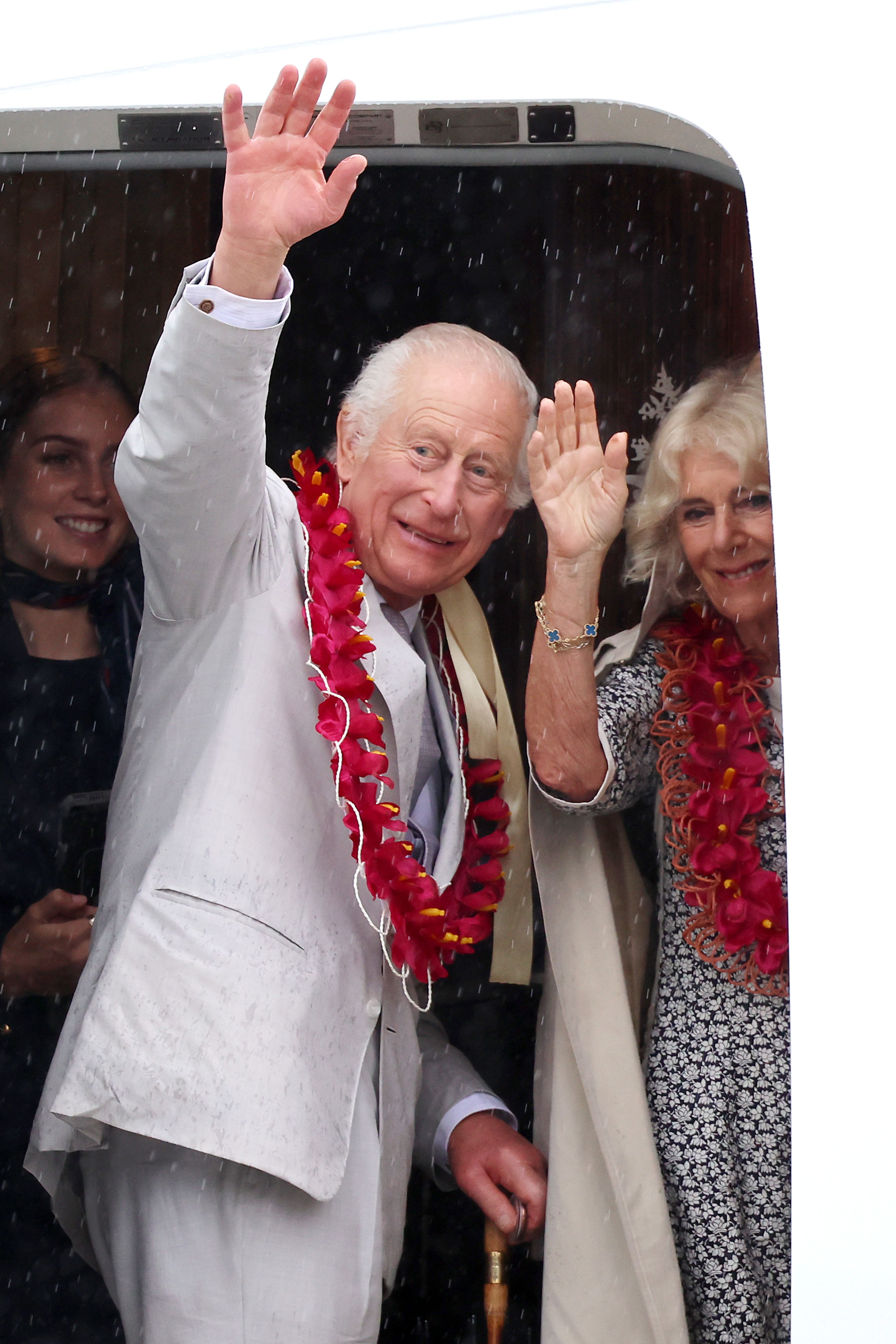 King Charles III and Queen Camilla waving goodbye. | Source: Getty Images